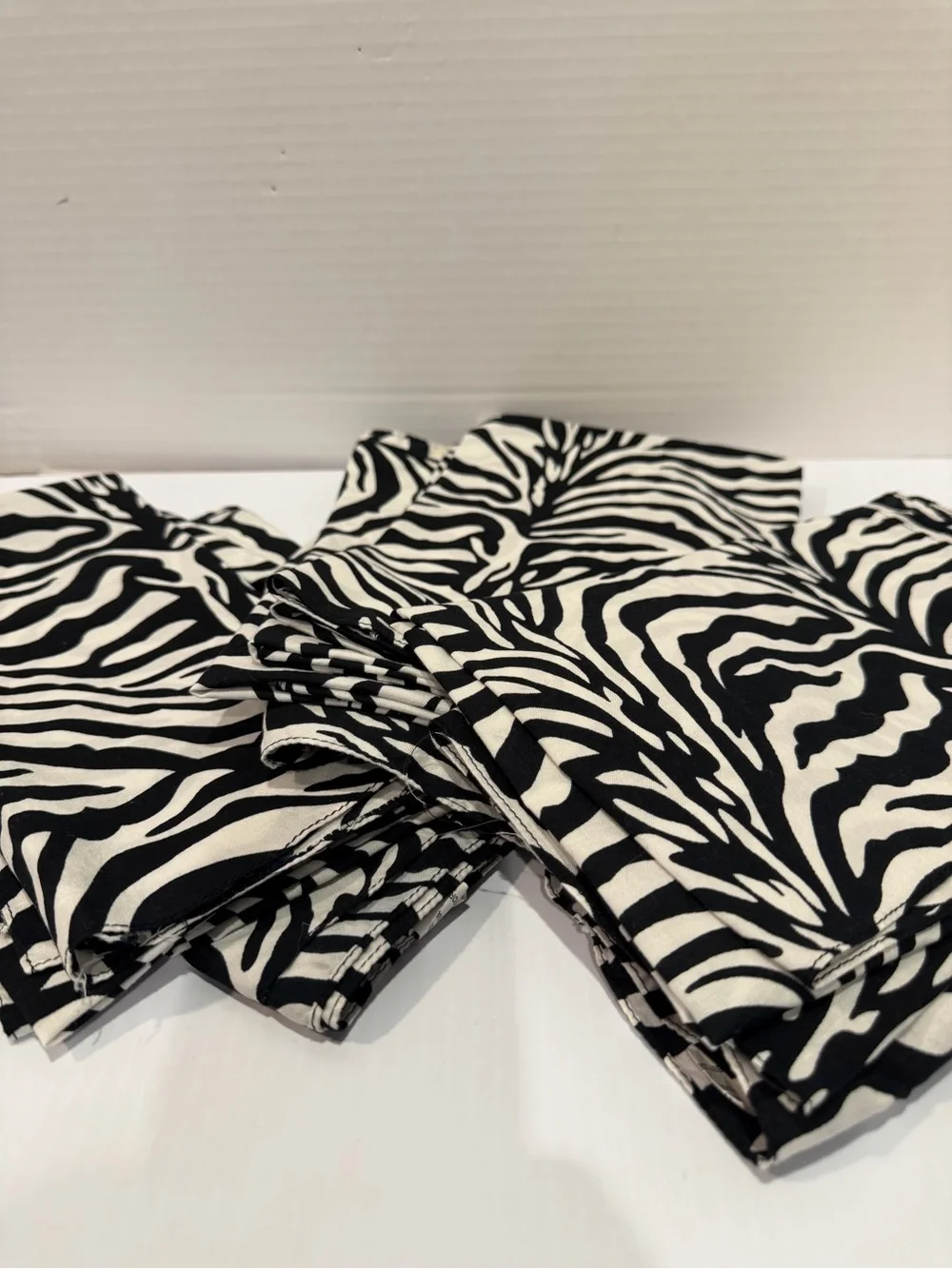 Set of 13 cotton 20x20” Zebra Print Napkins, Black & White, used for a party.